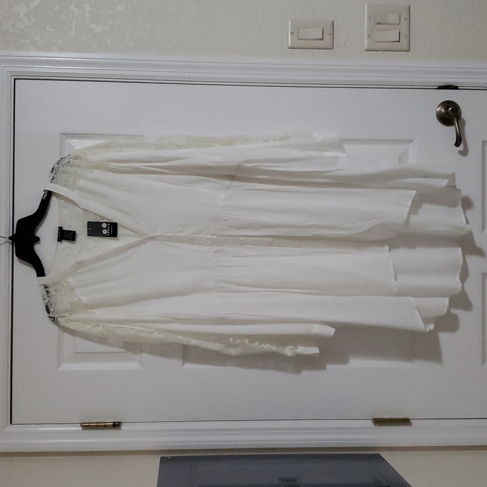 Torrid high low time with lace sleeves